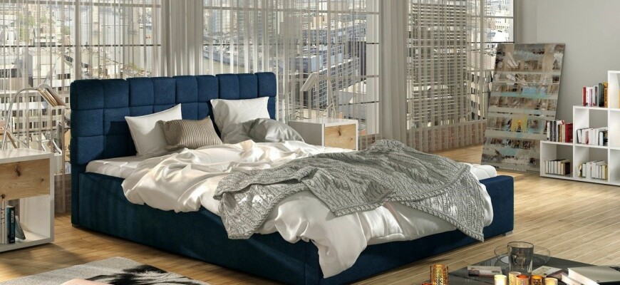 Мягкая кровать в синем цвете